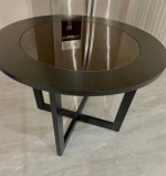 round wooden table with glass