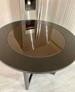 round wooden table with glass
