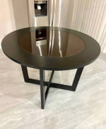 round wooden table with glass