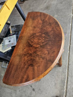Newly refinished Burlwood half circle table.
