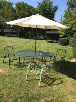 Patio table and 4 stackable chairs and umbrella  All for one price off