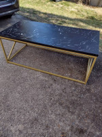 Metal coffee table with synthetic top