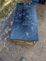 Metal coffee table with synthetic top