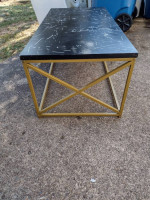 Metal coffee table with synthetic top