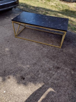 Metal coffee table with synthetic top
