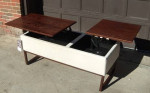 Coffee table / storage pop up tops unique very nice go see