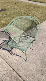 4 Wrought Iron Barrel Chairs and 1 Side Table Outside Patio