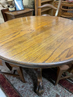 42 inch round oak pedestal clawfoot table with four fabric seat chairs