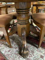 42 inch round oak pedestal clawfoot table with four fabric seat chairs