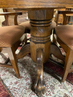 42 inch round oak pedestal clawfoot table with four fabric seat chairs