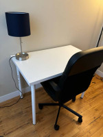 Desk chair with table and lamp