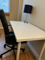 Desk chair with table and lamp