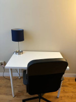 Desk chair with table and lamp