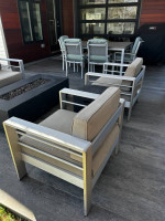 Patio table, chairs and bench with cushions