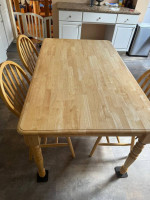 Kitchen wooden table and three chairs