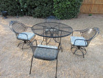 Wrougt Iron patio set. With table and 4 chairs.