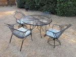 Wrougt Iron patio set. With table and 4 chairs.