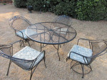 Wrougt Iron patio set. With table and 4 chairs.
