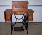 1889 New Home Cast Iron Treadle Sewing Machine Walnut Coffin Top Table