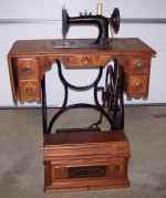 1889 New Home Cast Iron Treadle Sewing Machine Walnut Coffin Top Table