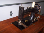 1889 New Home Cast Iron Treadle Sewing Machine Walnut Coffin Top Table