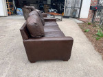 Leather couches and wood coffee table