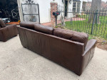Leather couches and wood coffee table