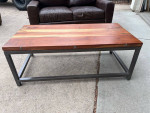 Leather couches and wood coffee table