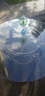 Circular Glass Table on a Bronze Base