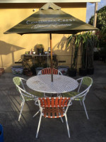 An outdoor set of 44-inch round table and four chairs