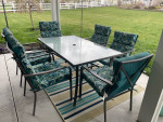 Patio table, six chairs and rug