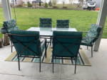 Patio table, six chairs and rug