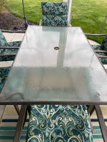 Patio table, six chairs and rug