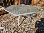 Outdoor Patio table glass top aluminum frame. Measures 54 inches acros