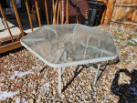 Outdoor Patio table glass top aluminum frame. Measures 54 inches acros