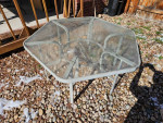 Outdoor Patio table glass top aluminum frame. Measures 54 inches acros
