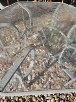 Outdoor Patio table glass top aluminum frame. Measures 54 inches acros