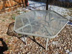 Outdoor Patio table glass top aluminum frame. Measures 54 inches acros