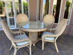 Round Rattan 48" Patio table and four padded chairs
