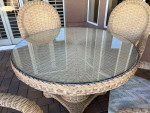 Round Rattan 48" Patio table and four padded chairs