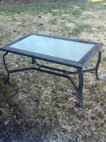 Outdoor table with glass top