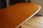Newly-restored "boat-shaped" Danish expandable teak dining table
