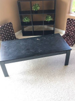 Cubby bookshelf; black coffee table; brown coffee table