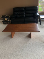 Cubby bookshelf; black coffee table; brown coffee table
