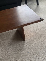 Cubby bookshelf; black coffee table; brown coffee table