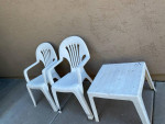 Two outdoor plastic chairs and one table. No cracks, just some paint spots. $10