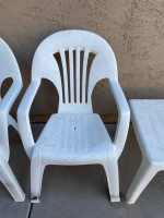 Two outdoor plastic chairs and one table. No cracks, just some paint spots. $10