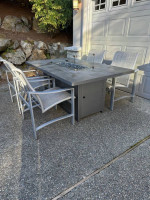 Like new Patio fire table & 4 chairs