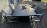 Like new Patio fire table & 4 chairs