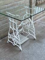 Awesome Glass Top Table Sitting On An Antique Sewing Machine Stand.